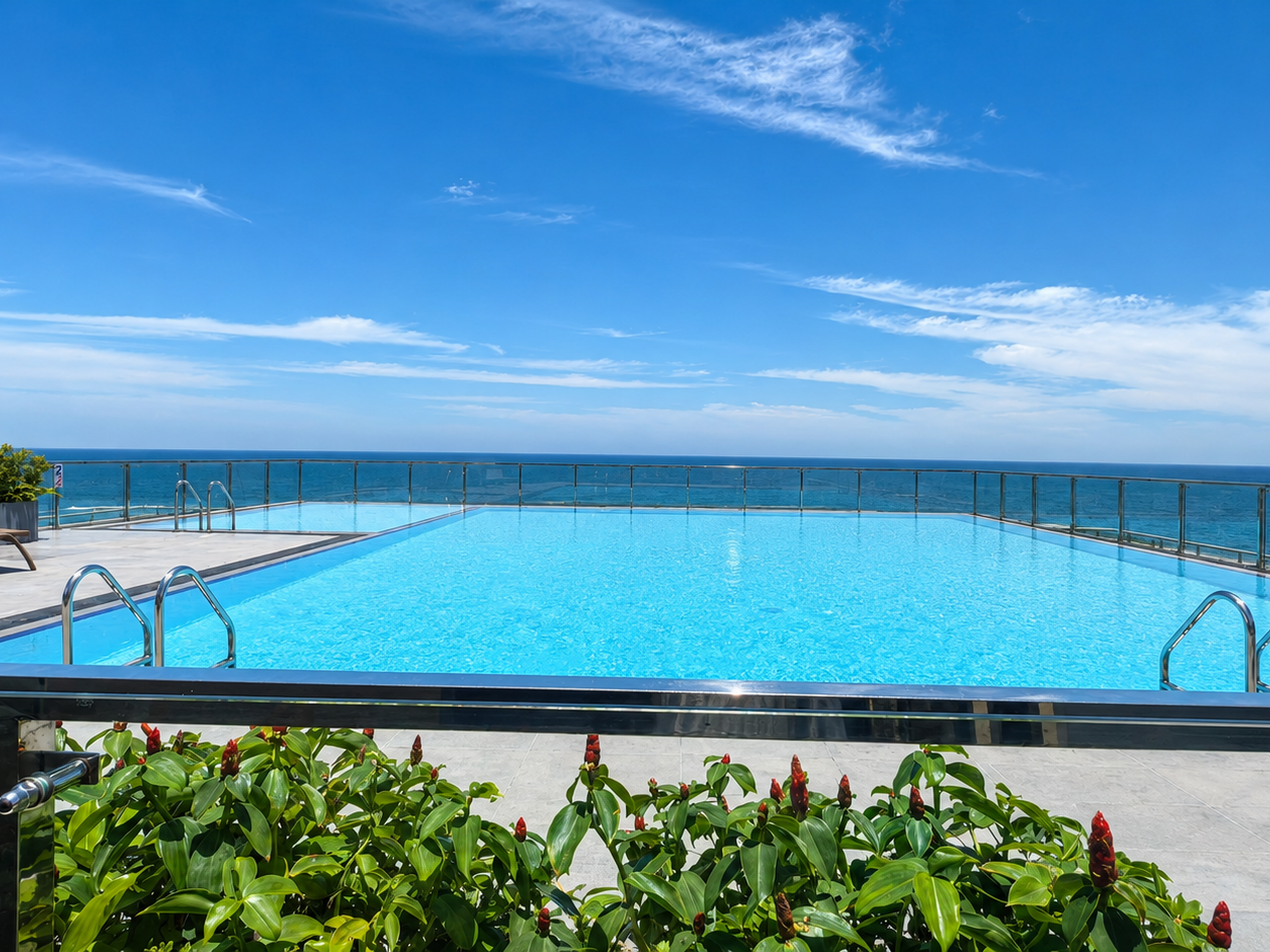 Rooftop pool with ocean view at Colombo Seaview Residencies